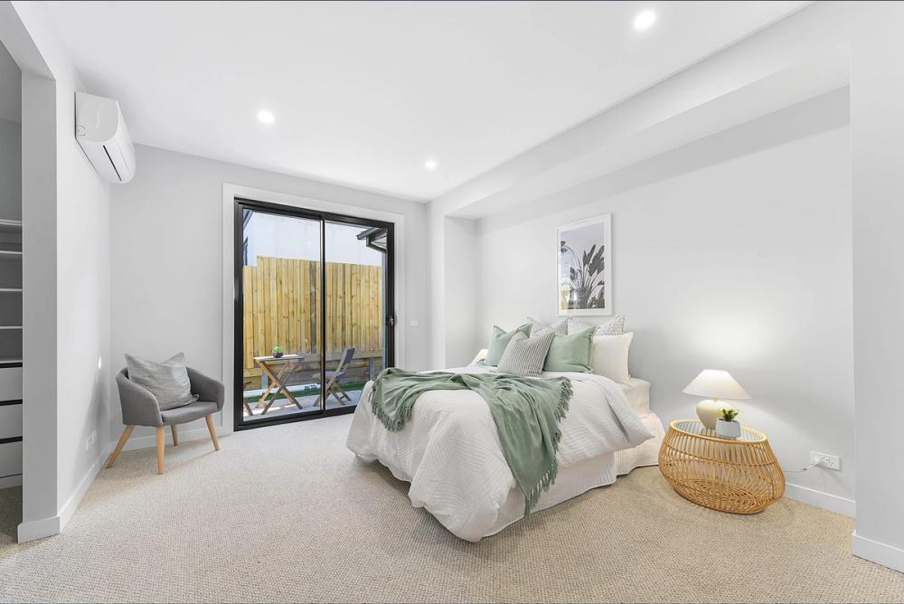 Bedroom opening to a courtyard through sliding doors, Bentleigh East Development, Bentleigh East