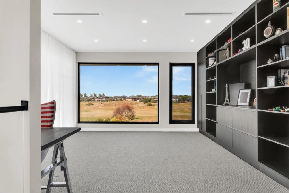 Home office with black built-in joinery and golf-course views, Tiffany Walk Residence, Sanctuary Lakes