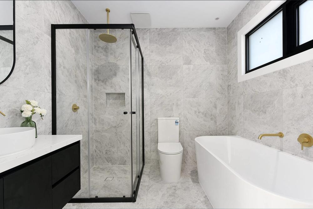 Bathroom with freestanding tub, gold tapware and glass shower, Bentleigh East Development, Melbourne