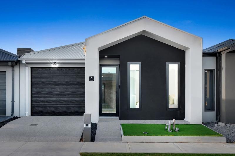 Charcoal-and-white single-storey custom home with a cathedral roofline and double garage - Tarneit Cathedral Residence, Melbourne