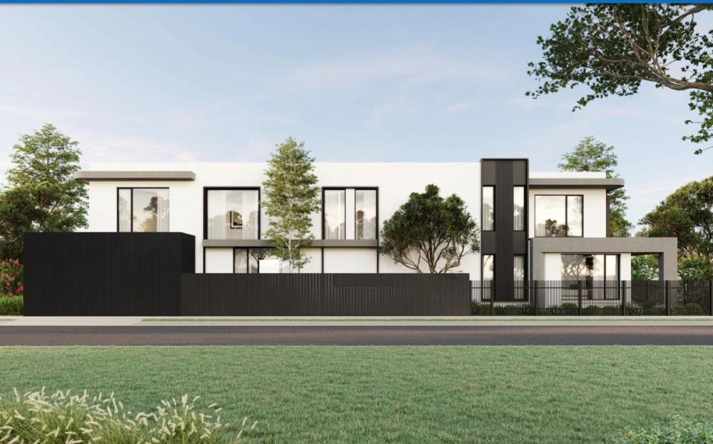 Street view of the rendered two-storey facade with a dark feature stair tower, Collingwood Residence, Collingwood