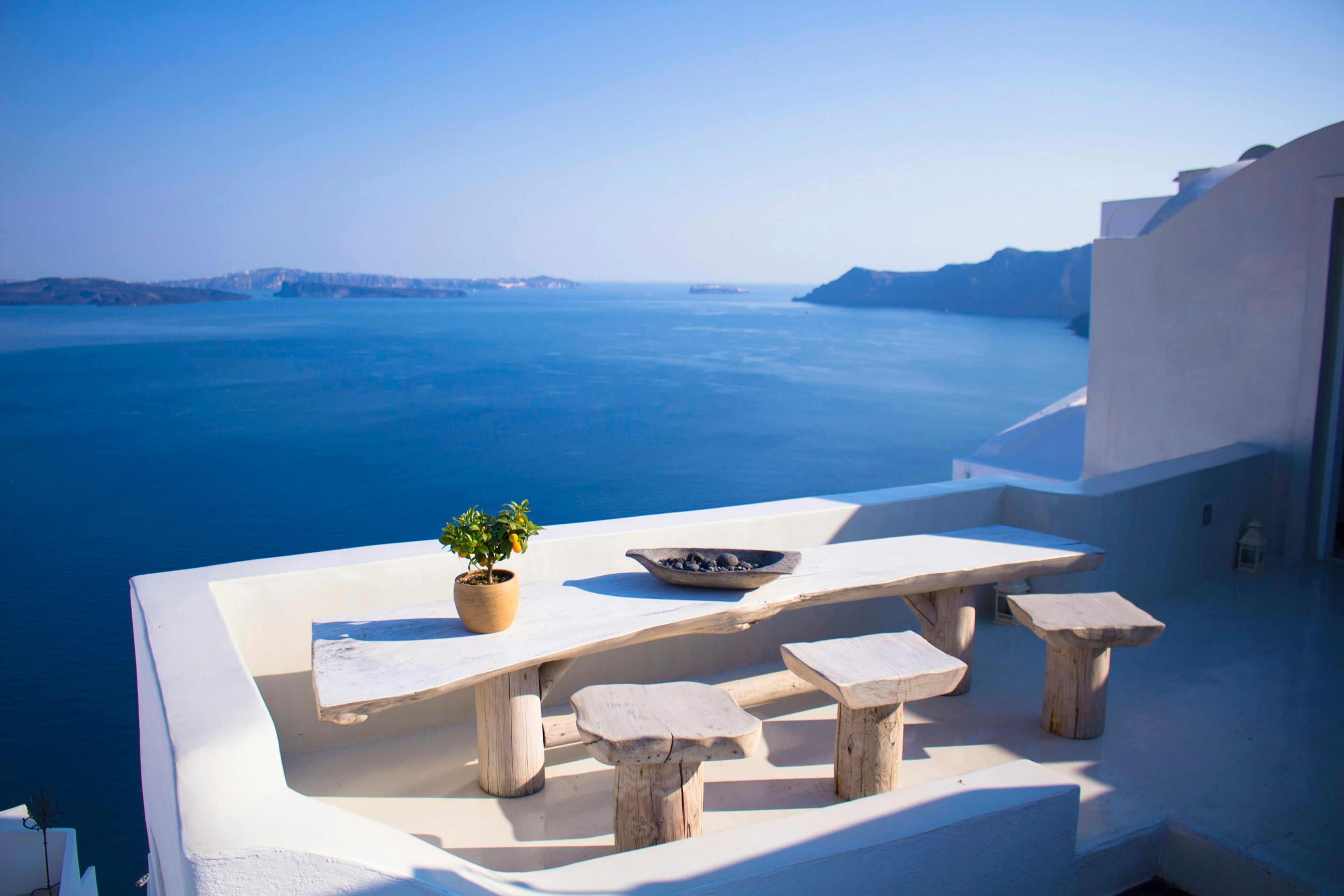 White terrace with a table overlooking the sea