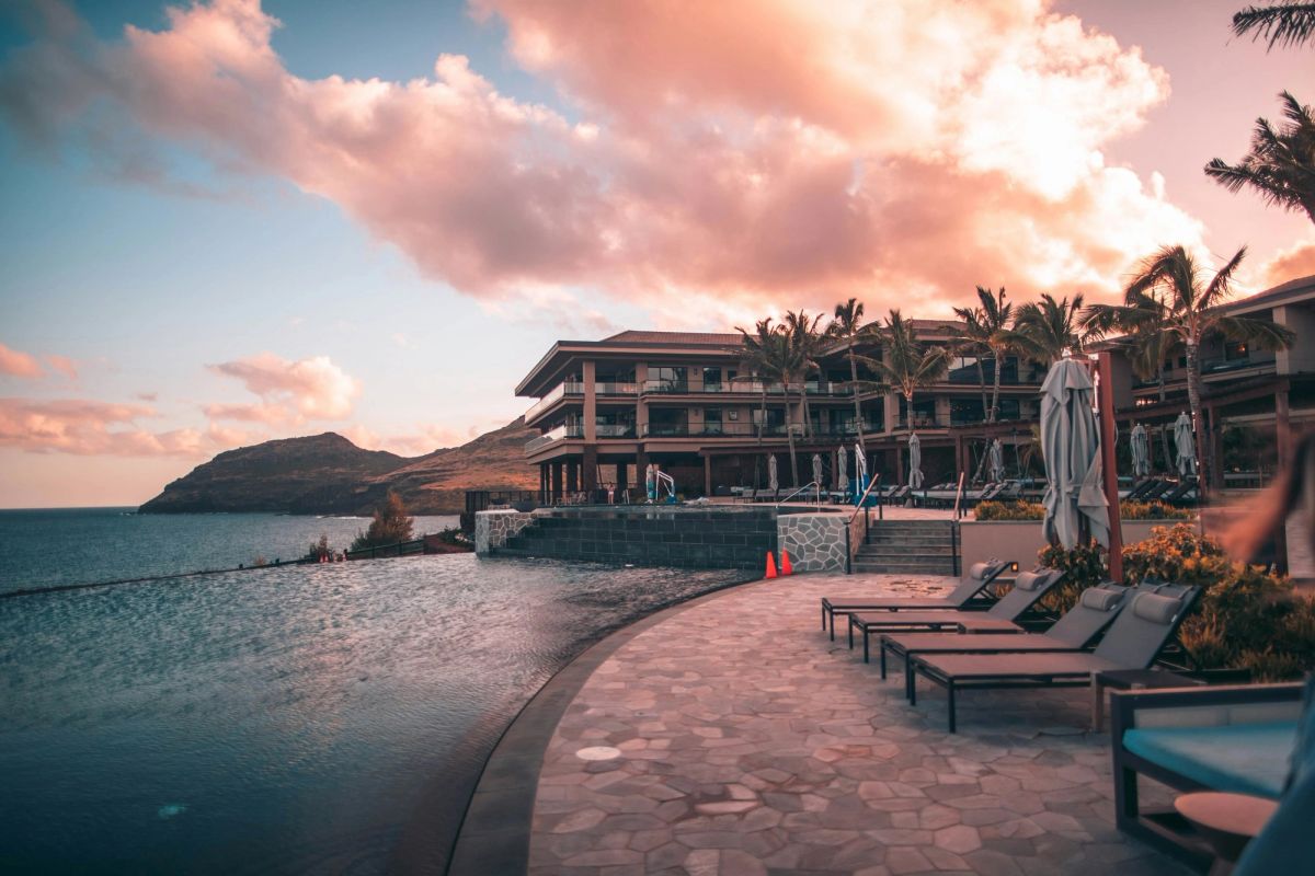 Terrace pool and loungers at sunset