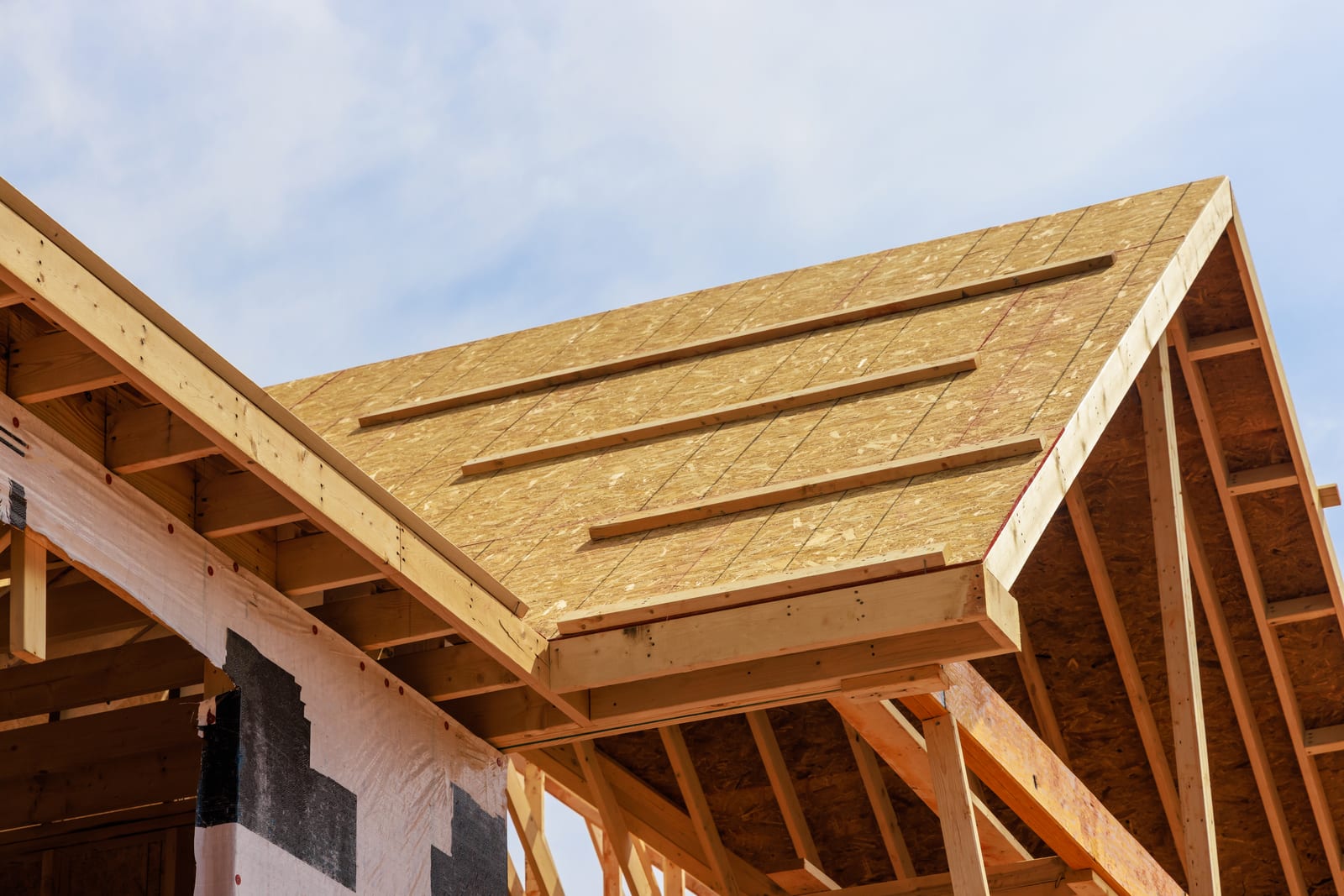 Residential wood framing construction with OSB sheathing