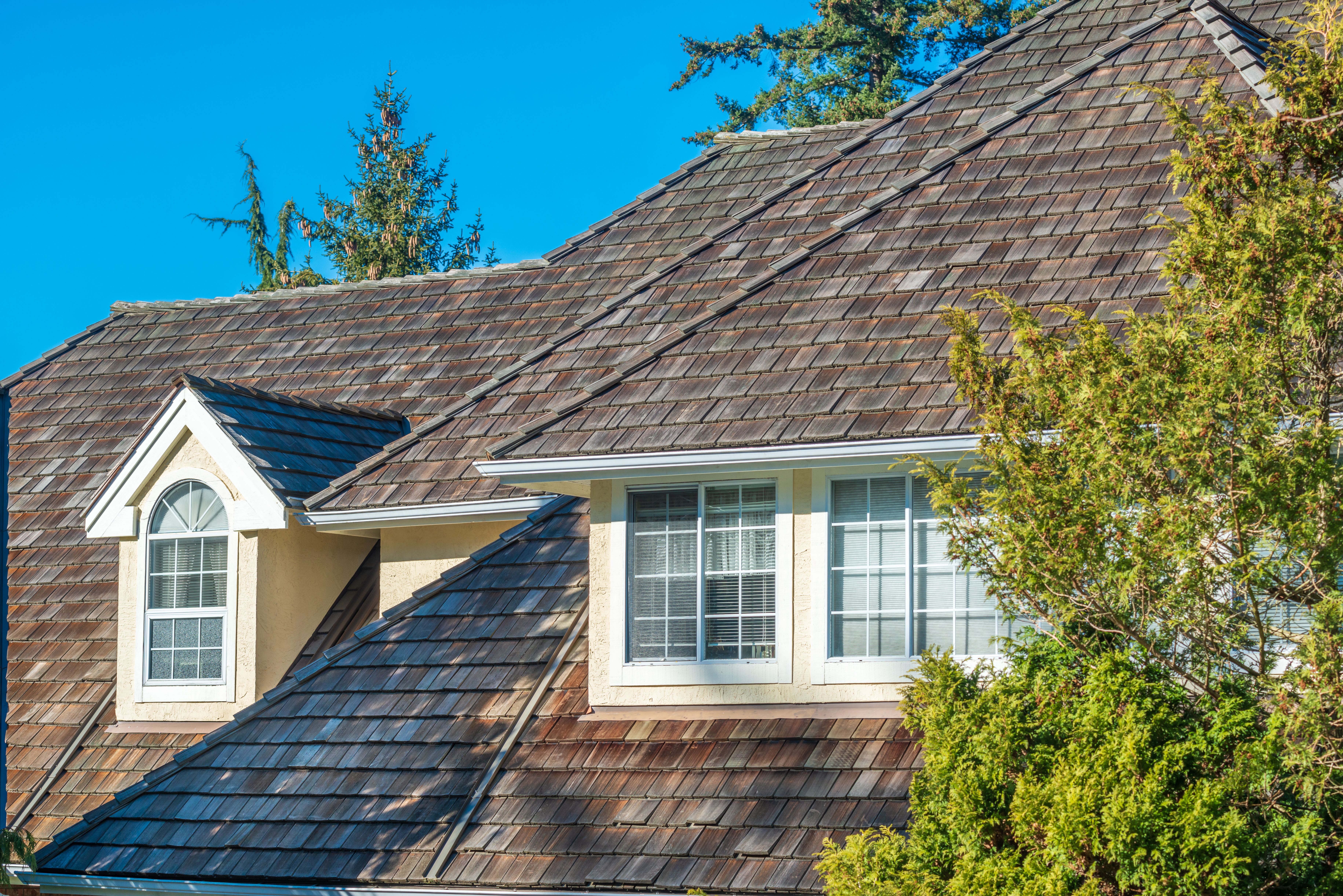 House roof with shingles and cedar shakes