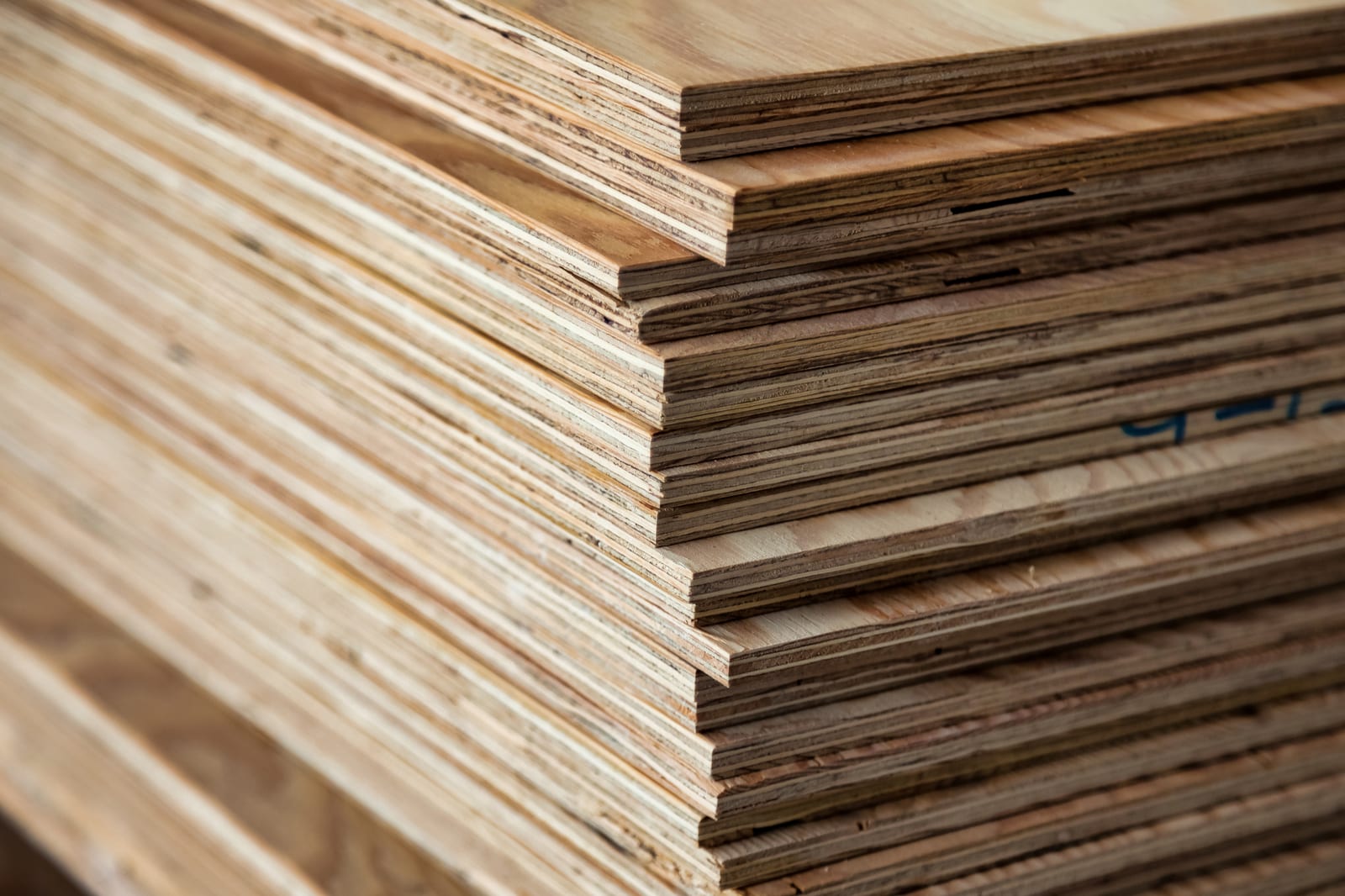 Plywood sheets stacked in a workshop