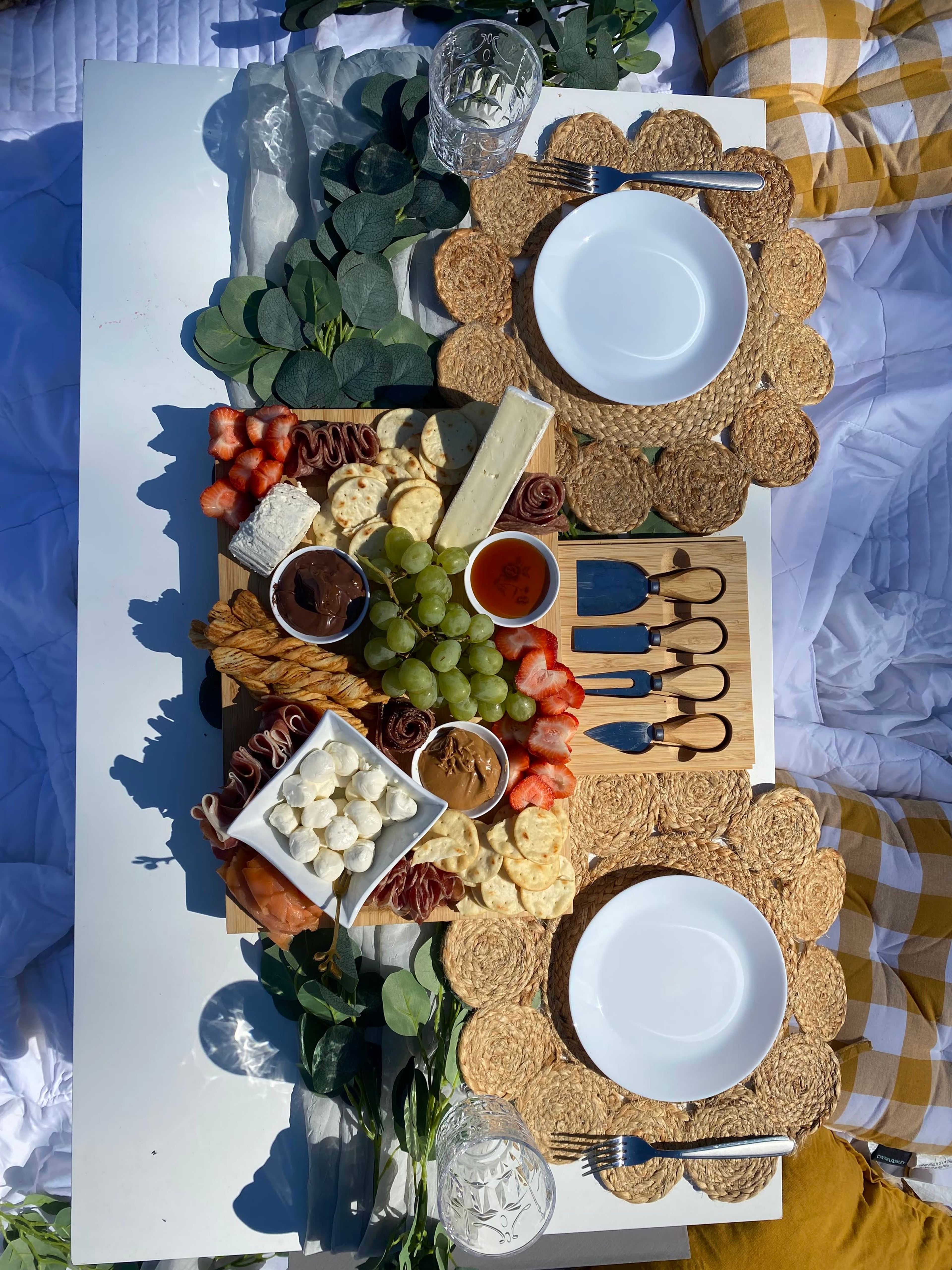 A picnic setup with Taste of Company signage on a blanket