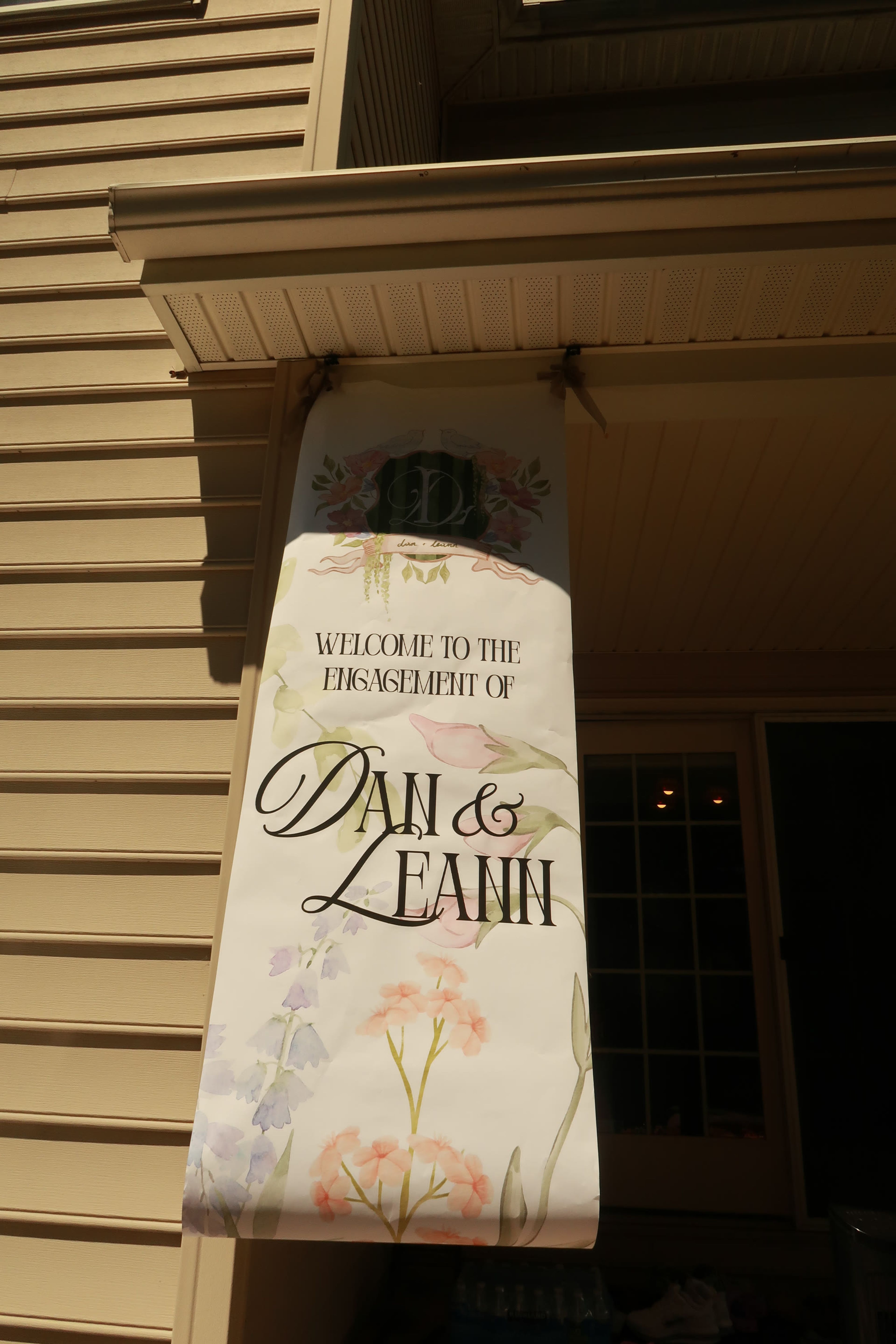 A welcome sign lettered for the engagement of Dan and Leann
