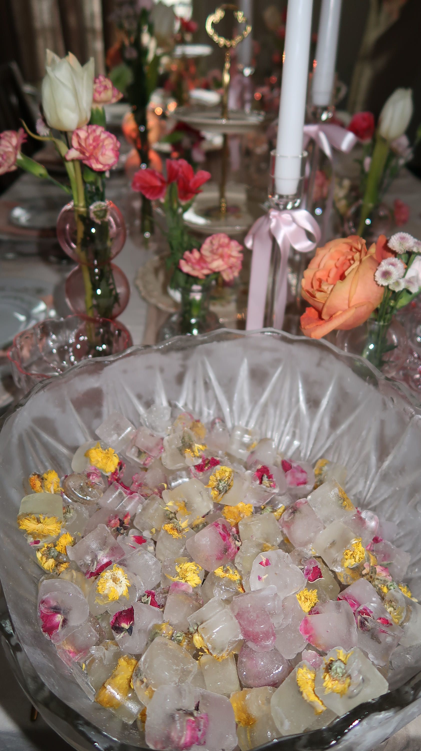 A cut-glass bowl of floating flower petals