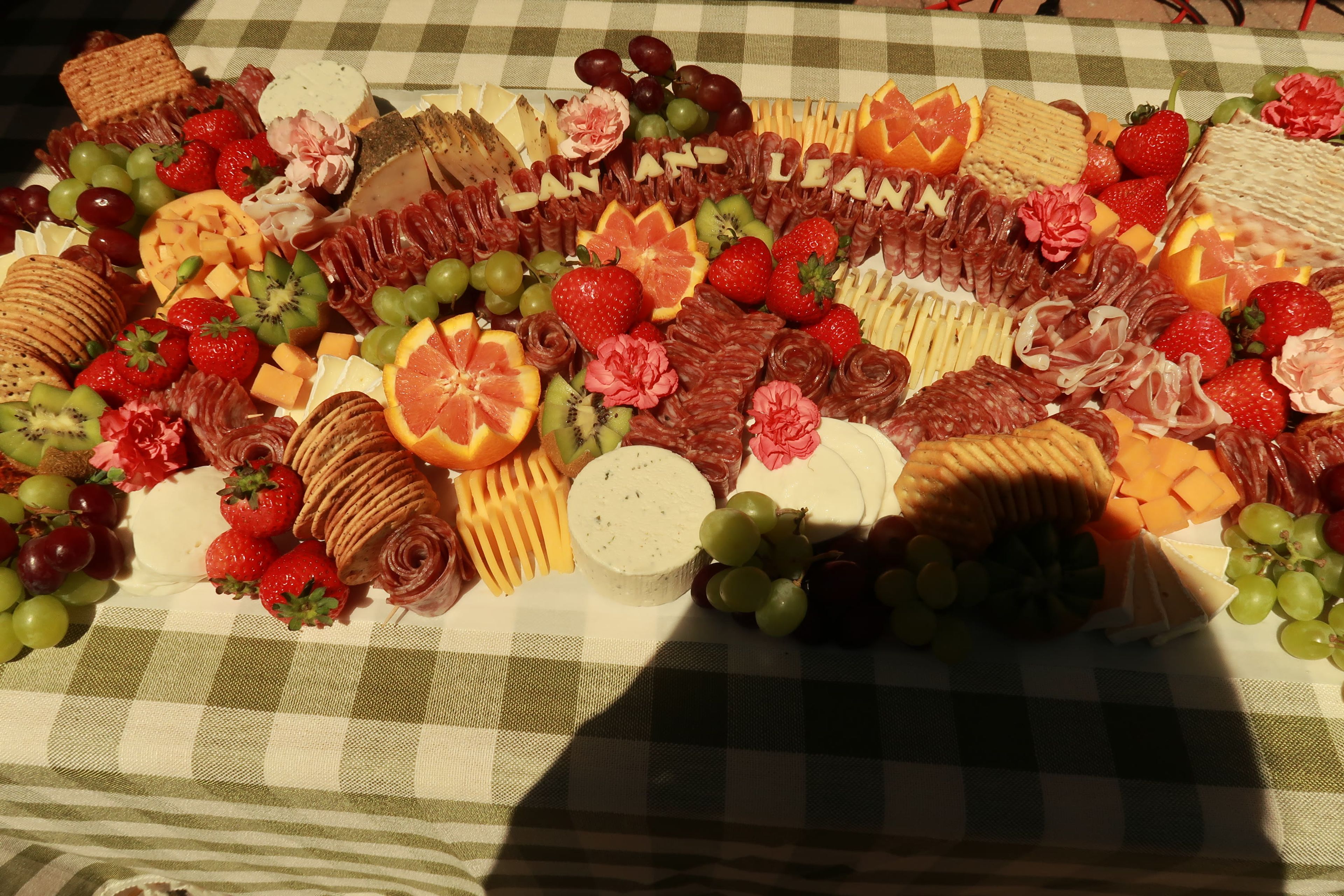 A long grazing board lettered 'Dan and Leann'
