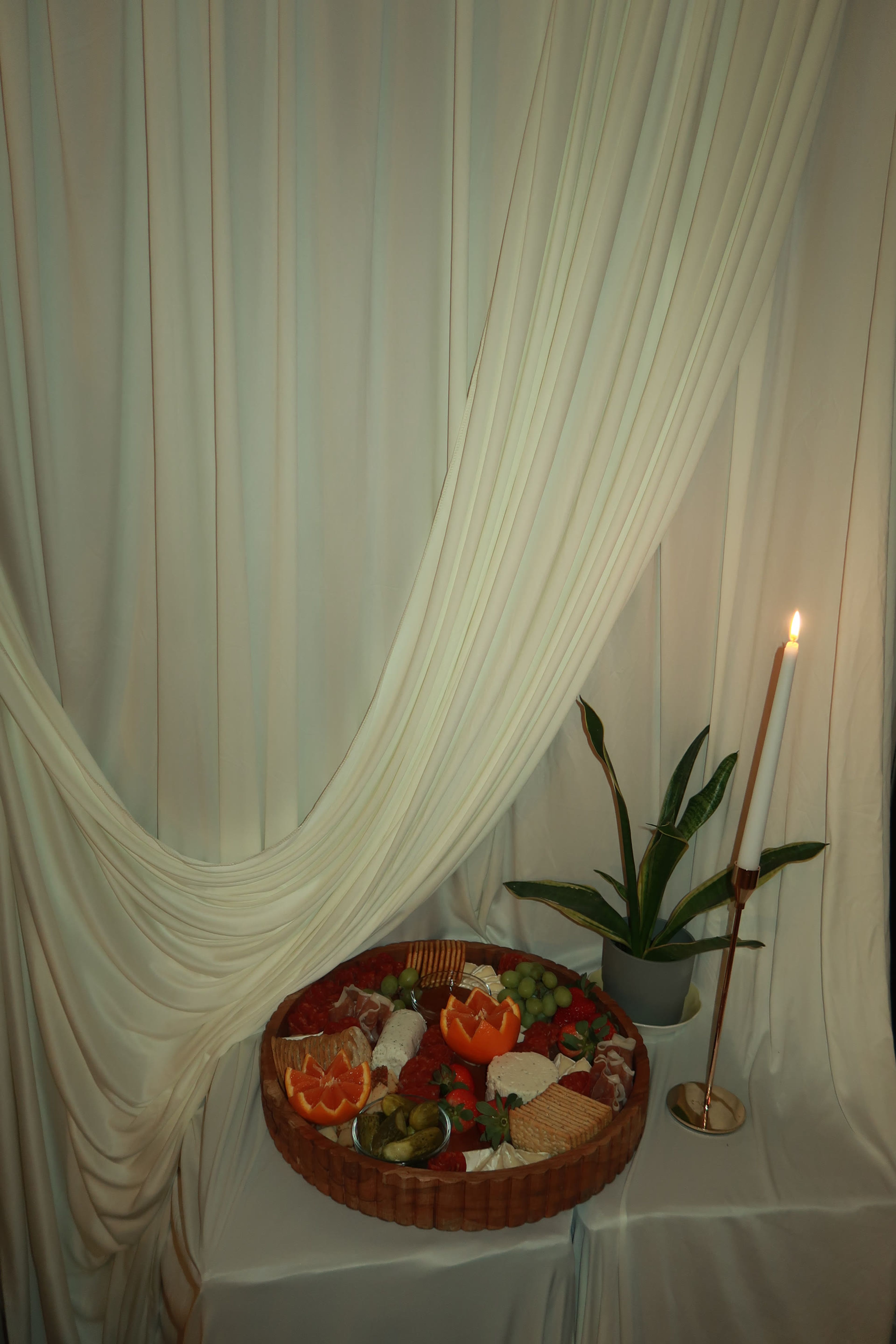 Drapery and greenery behind a grazing board