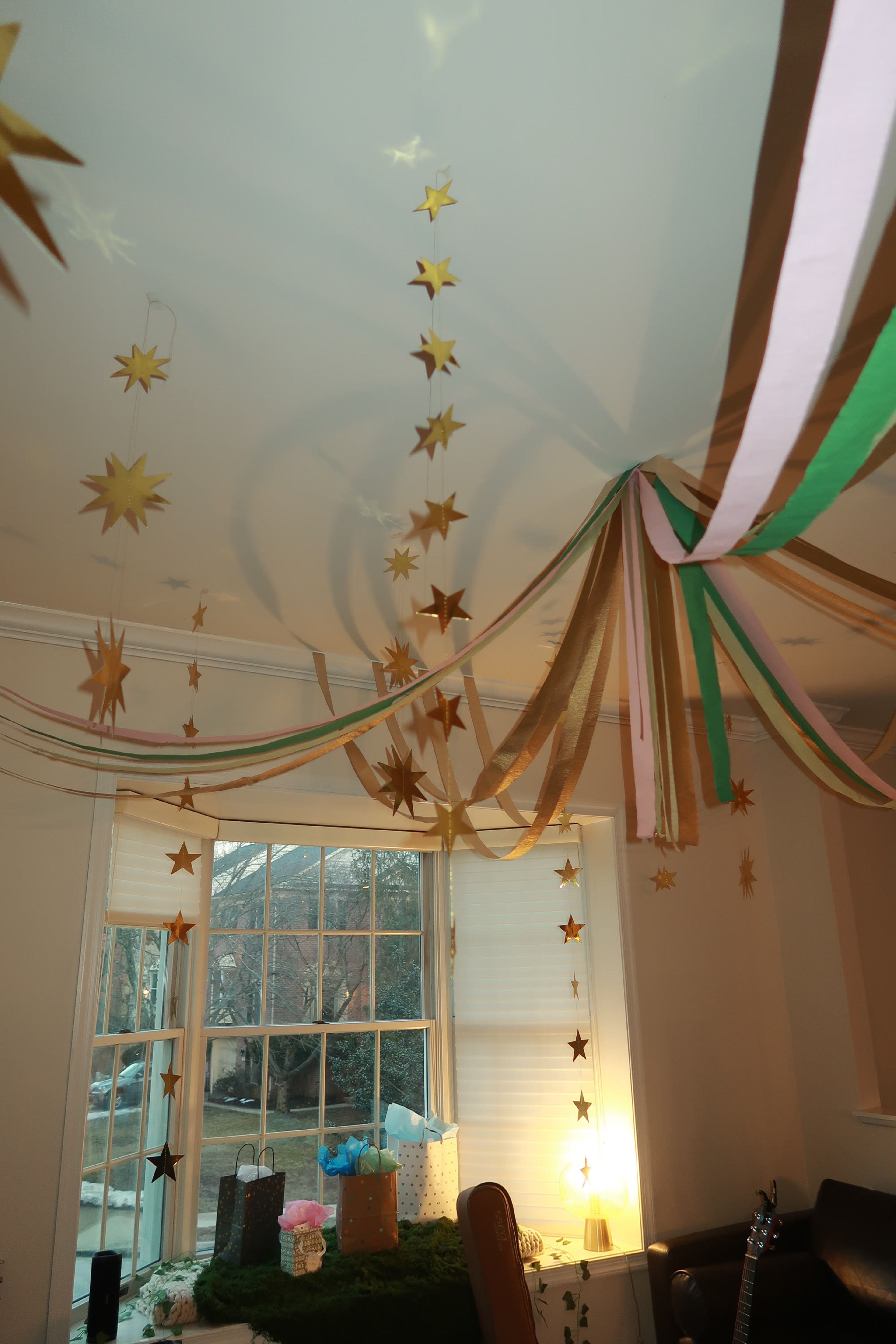Streamers and paper stars strung across a ceiling