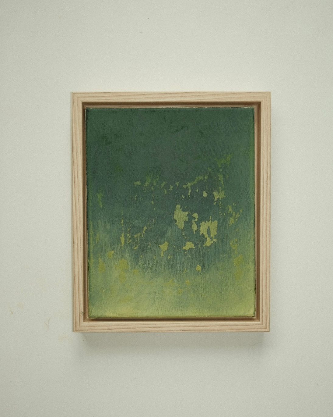 Deep forest green that fades into yellow-green at the bottom, with scattered pale flecks.