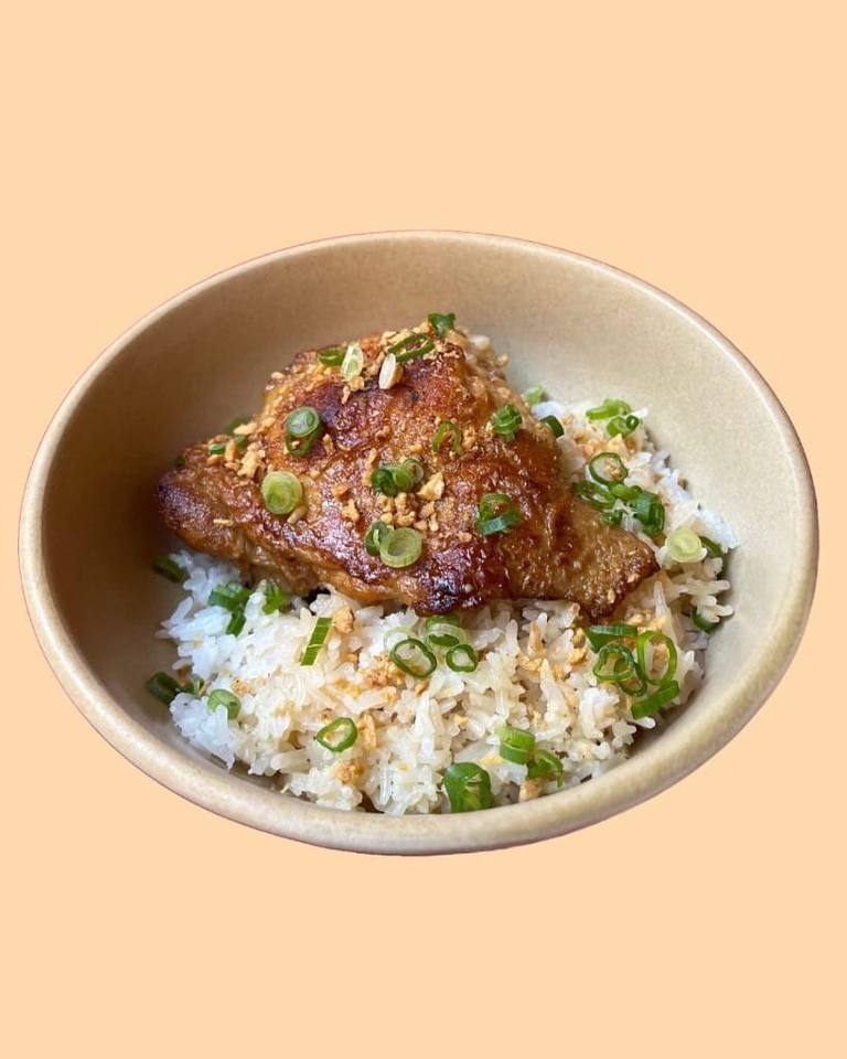 Chicken inasal on garlic rice with spring onions and crispy garlic, Boodle Fight Stirchley