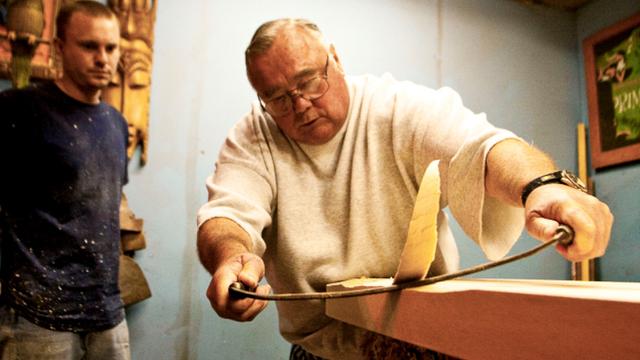 Greg Noll shapes an olo board, 2012