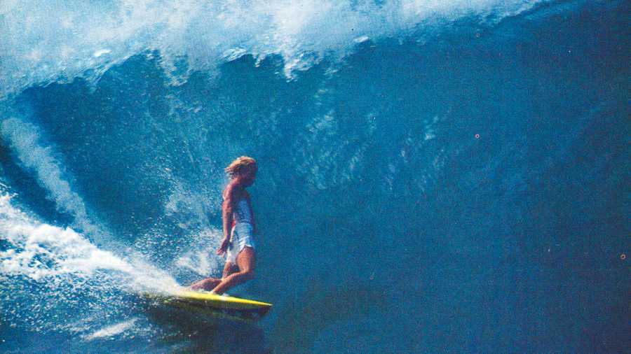 Joey Buran standing tall in a double-overhead barrel