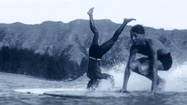 Plank-riding surfers in Waikiki, 1932