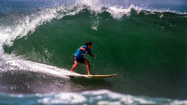 Kelly Slater at the US Open of Surfing at the Huntington Beach Pier, 1996.