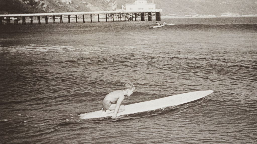 lance carson as a boy at Malibu, surfing