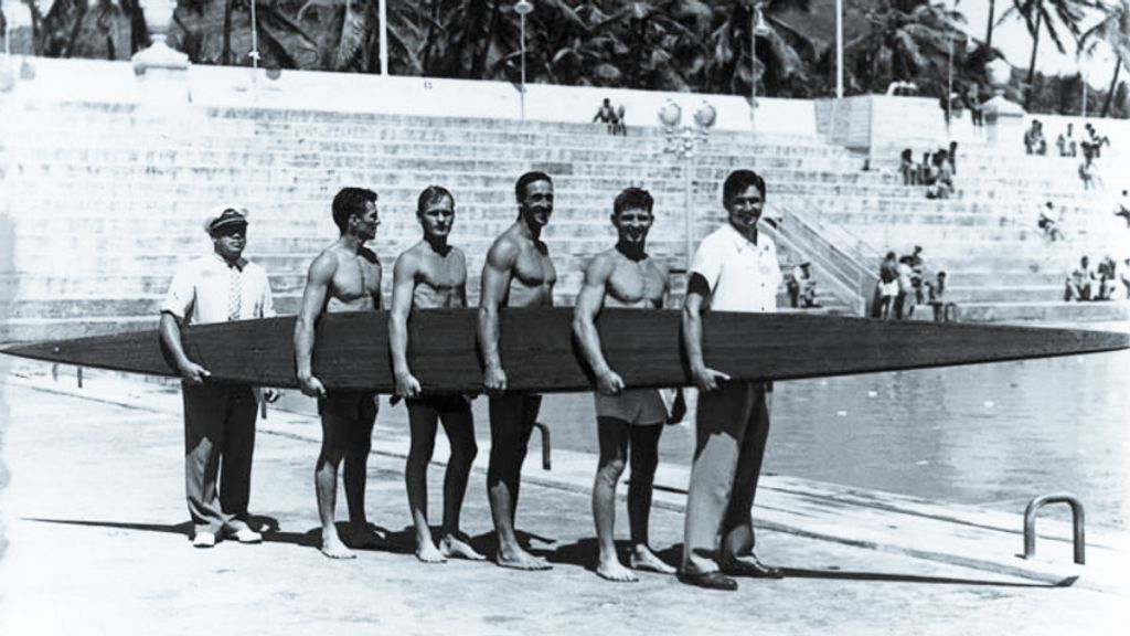 Paddleboarders in Waikiki, including Gene Tarzan Smith