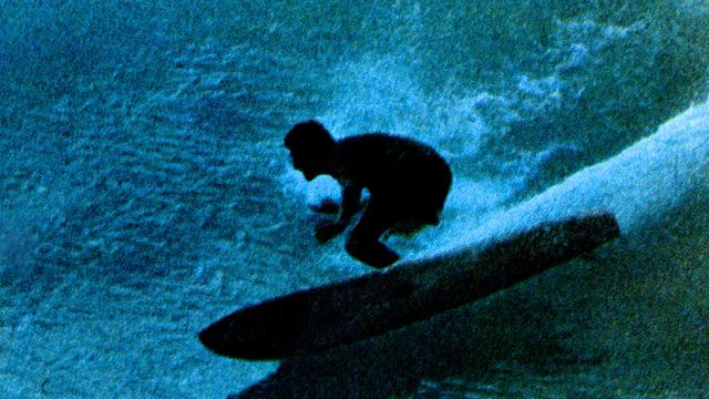 Nat Young rides his deep-vee "plastic machine" at Honolua Bay, 1967. Photo: John Witzig