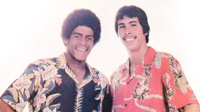 Mark Liddell (right) and Buttons Kaluhiokalani, ad shoot, 1980
