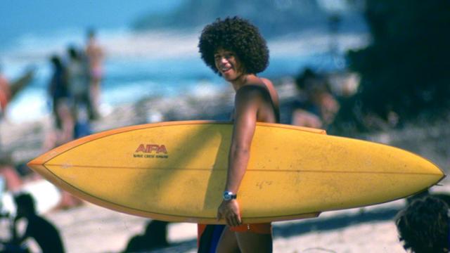 Larry Bertlemann with sting surfboard, 1975