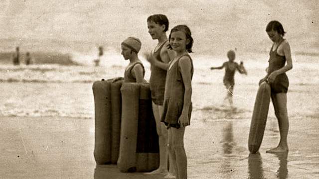 Mat surfers at Bondi, 1940s