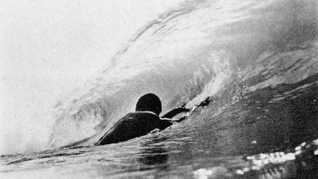 Ghanian surfer, 1974, paddling out on a bellyboard. Photo: Craig Peterson