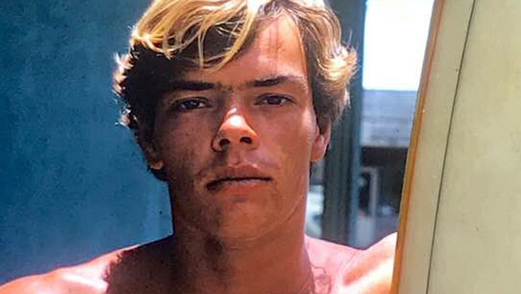 Jim Wildman Neece, with surfboard, on the North Shore of Oahu in 1972