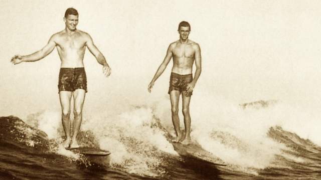 Wally Froiseth surfing Queens with George Downing (right), 1949