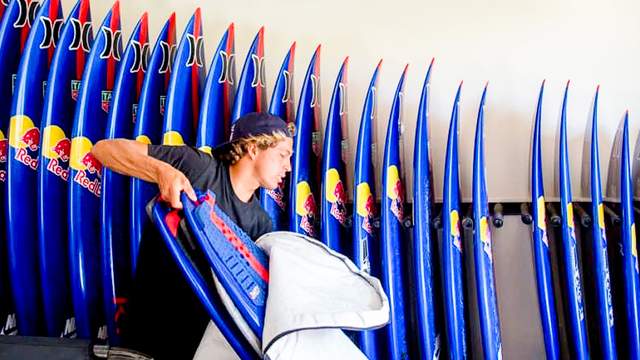 Tow surfing ace Kai Lenny with quiver of boards, 2019