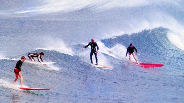 Wetsuit-wearing surfers at North Fistral, England, 1964. Photo: Doug Wilson