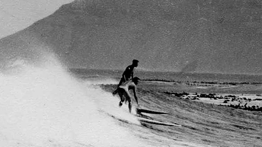 John Whitmore and David Meneses, surfing at Kommetjie