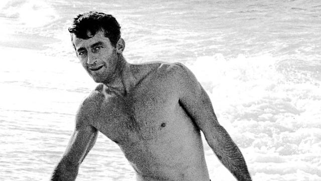 Pat Curren and spearfish-caught turtle, North Shore, 1962. Photo: Ron Church