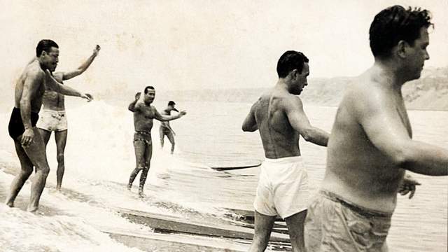 Surfing in front of Club Waikiki, 1953