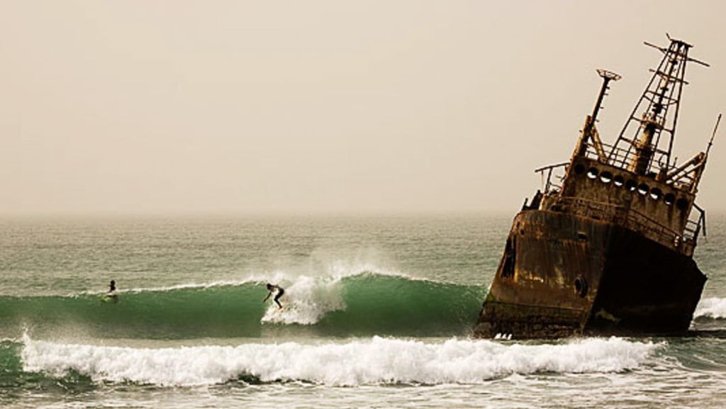 surfing next to shipwreck