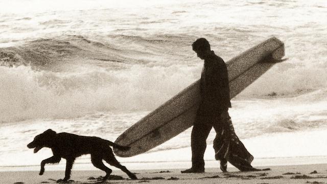 Nat Young and vee-bottom board, 1967. Photo: Alby Falzon