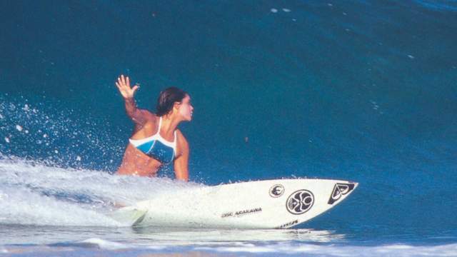 Megan Abubo on an Arakawa-shaped surfboard, 1997. Photo: Hank