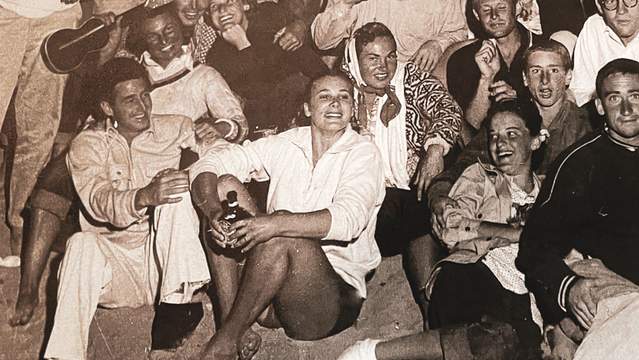 Vicki Flaxman (center front, white sweatshirt), Malibu party, around 1950