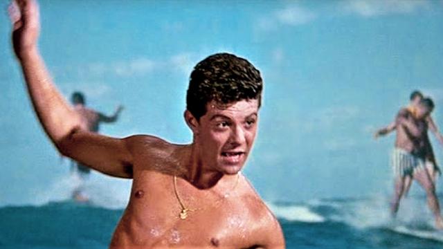 Frankie Avalon "surfing" in Beach Party