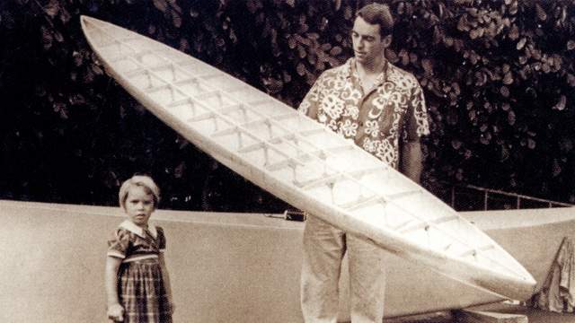 Joe Quigg with balsa paddleboard, 1960