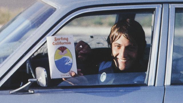 Shaun Tomson, early 1980s, with first edition of Surfing California. Photo: Larry Moore
