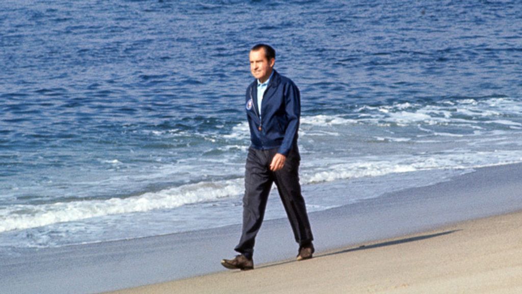 Richard nixon walks on the beach at Cottons Point, San Clemente