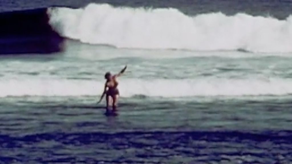 surfer Vicki Flaxman on the rocks at malibu in 1951