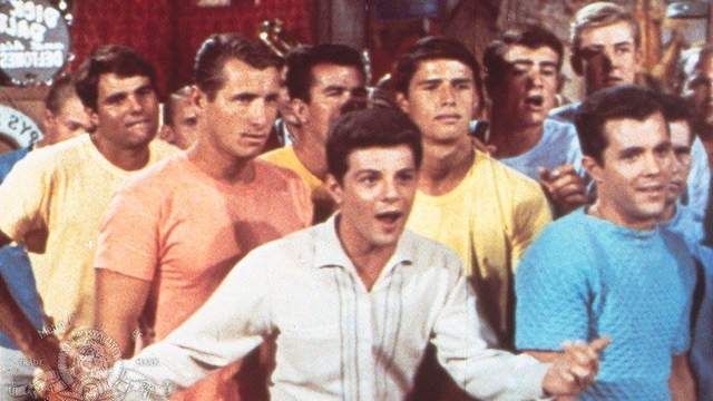 Frankie Avalon (center) and Miki Dora (far left), in Muscle Beach Party