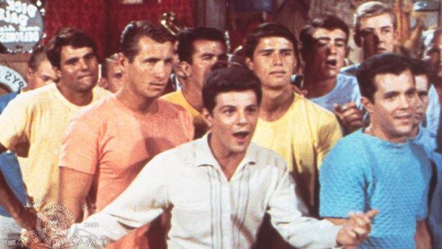 Frankie Avalon (center) and Miki Dora (far left), in Muscle Beach Party