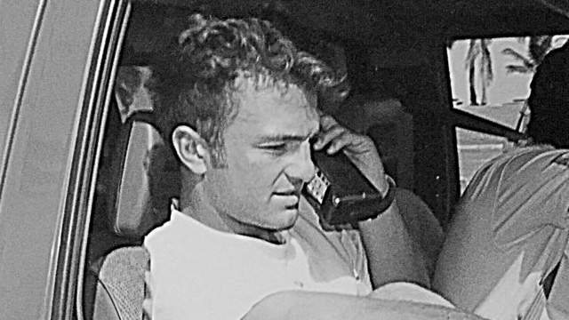 Tim Baker takes a phone call in the mid-80s