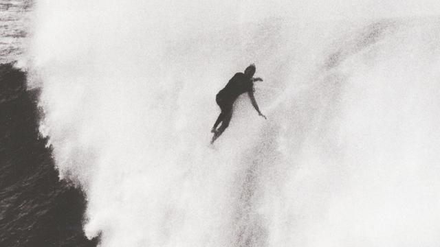 Keala Kennelly, over the falls at Waimea Bay. Photo: Arto Saari