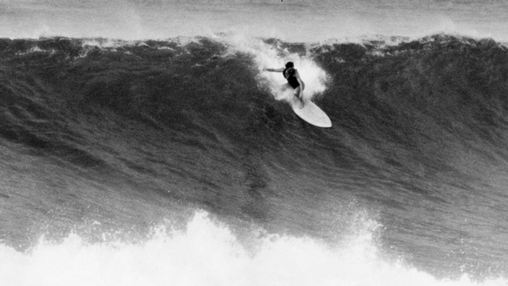 Jericho Poppler drops into a big wave at Sunset Beach, Hawaii